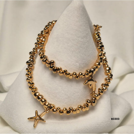 Gold bracelet with metal beads and decorative charms