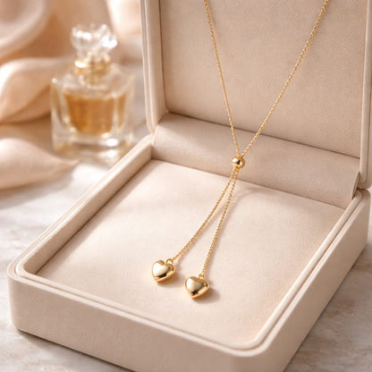 Collar ajustable de acero inoxidable 316L con dos colgantes de corazón