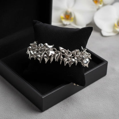 BRACCIALE MILLE CUORICINI IN ACCIAIO COLOR ARGENTO CON SONAGLIO