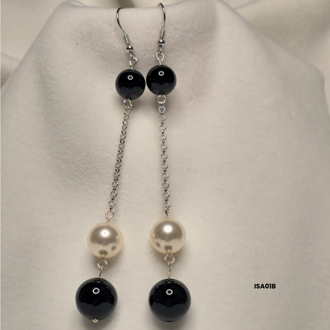 Earrings with 12 mm white Swarovski pearls and 10 mm and 14 mm black onyx with 925 sterling silver components