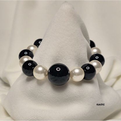 Bracelet with 12 mm white Swarovski pearls and natural black onyx stone