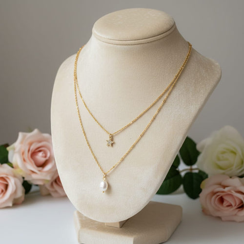Collana a doppia catena in acciaio placcato oro con perla d'acqua dolce e ciondolo a forma di stella