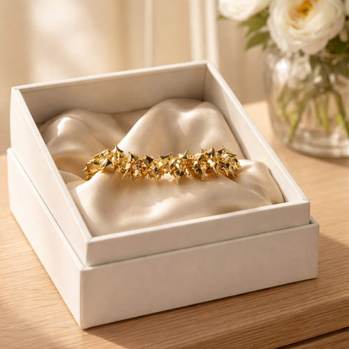 BRACCIALE MILLE CUORICINI IN ACCIAIO COLOR ARGENTO CON SONAGLIO